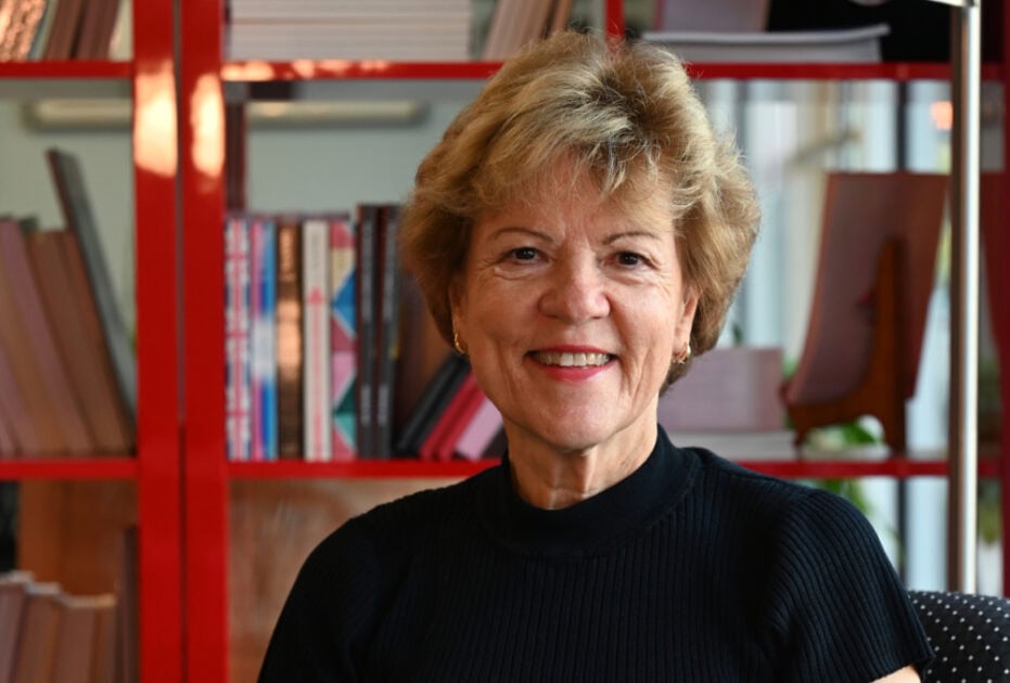 P m draper in front of book case