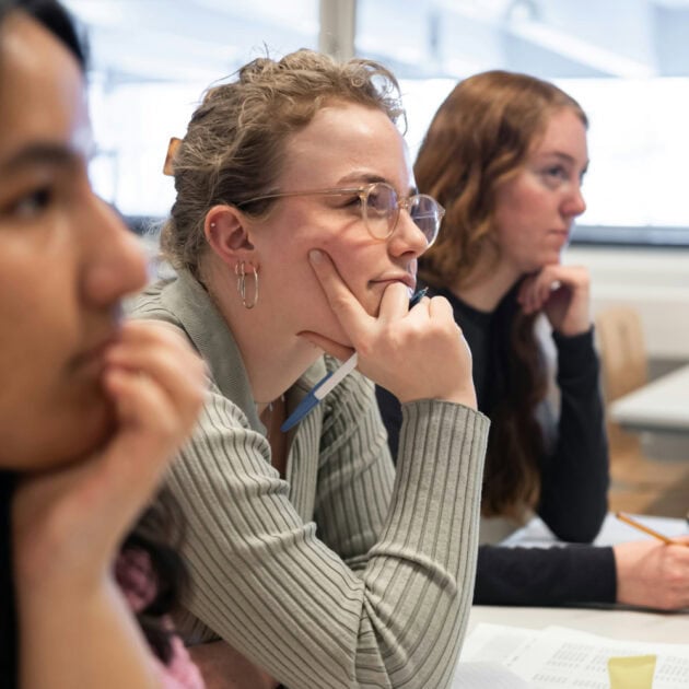 Students listening to p m draper